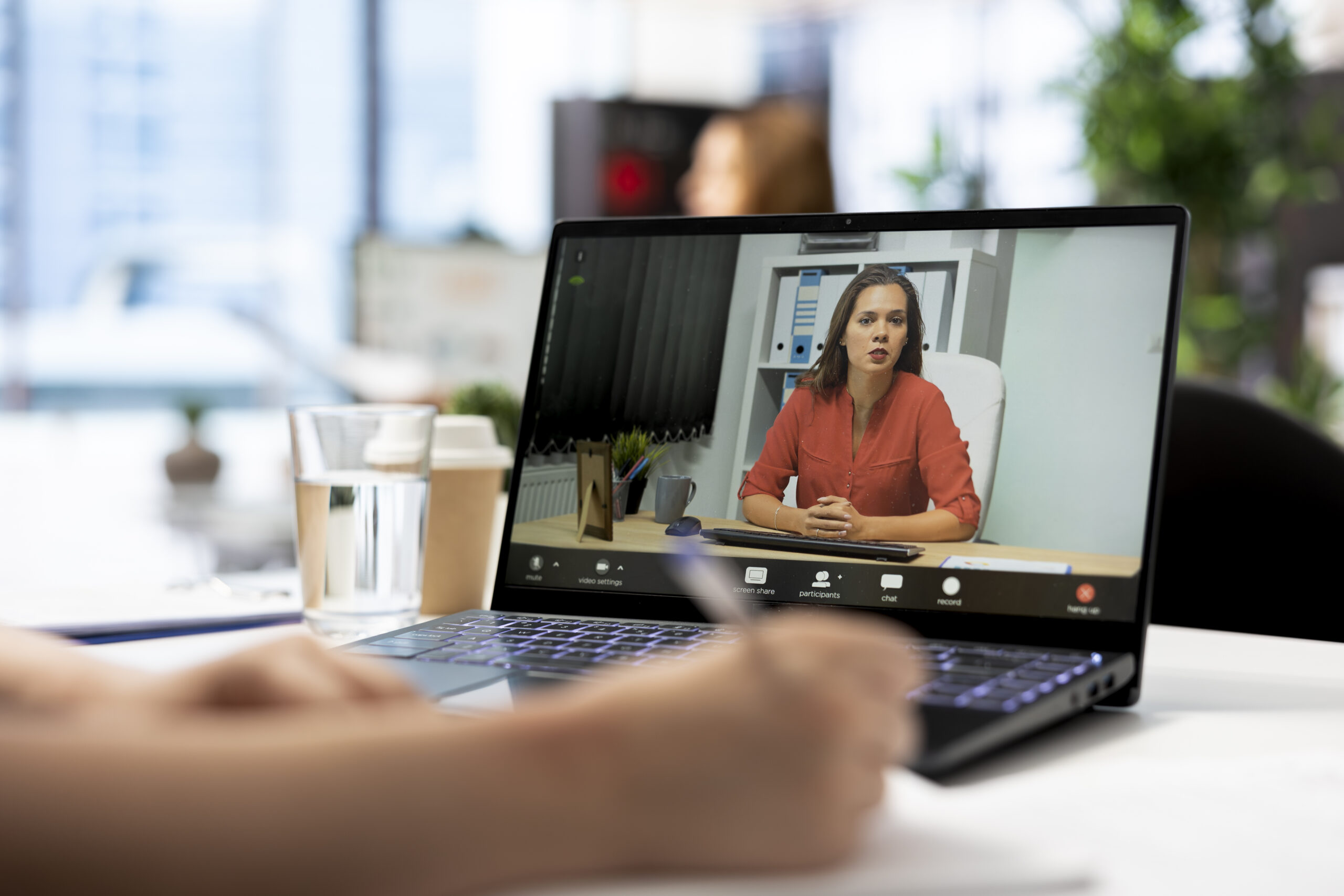 Job interview candidate interested in career advancement, talking with HR employee during videoconference meeting on laptop. Woman talking with recruiter during remote videocall on notebook